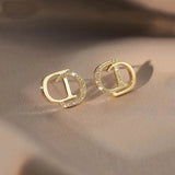 D Earrings In Sterling Silver